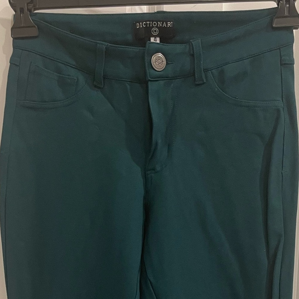 Emerald skinny pants.
